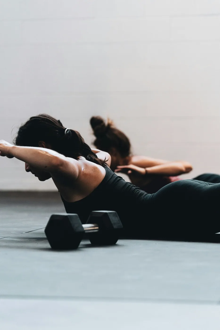 Prone dumbbell strength exercise in the studio